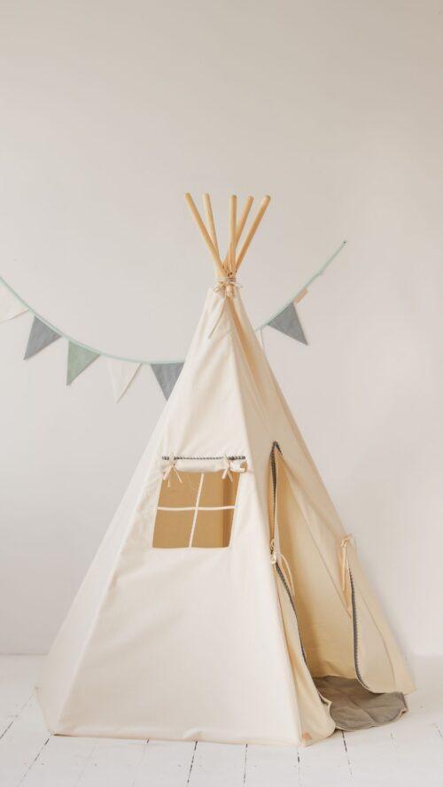 beige tipi with gray pompoms