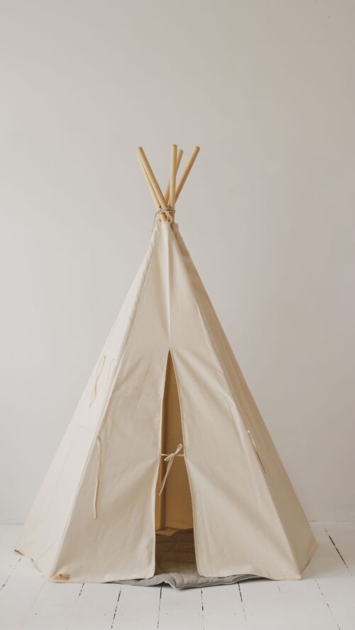 beige tipi with mat